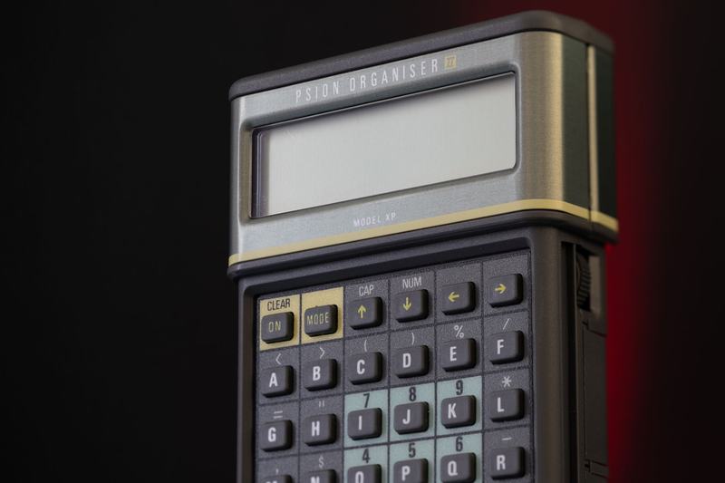 Vintage-style electronic calculator with a display