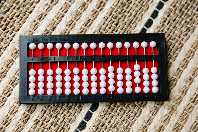 Japanese soroban abacus on a woven mat