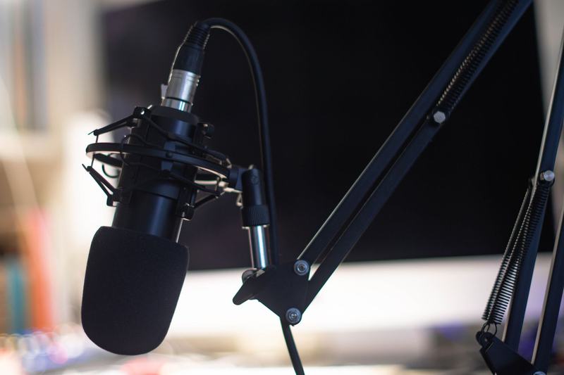 Studio microphone on a boom arm for recording audio