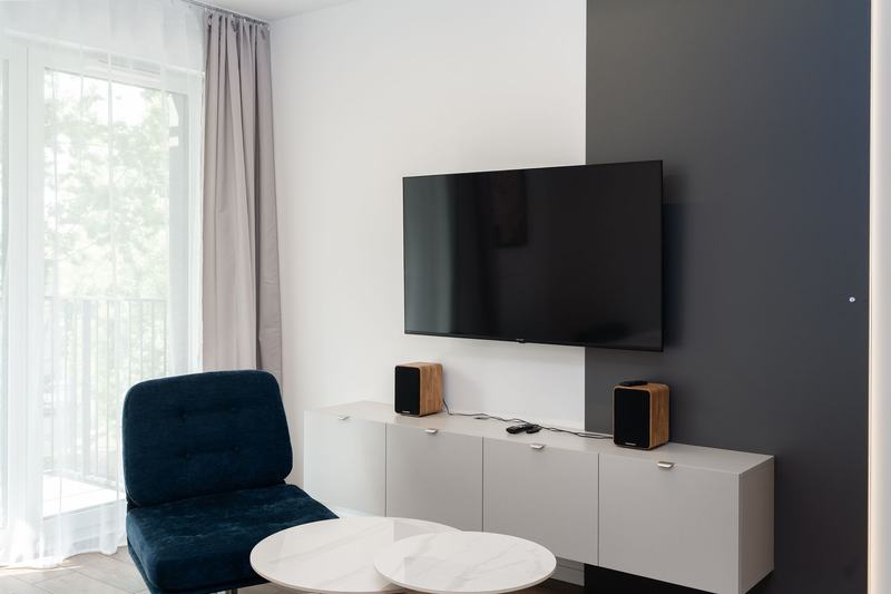Wall-mounted flat-panel television in a living room