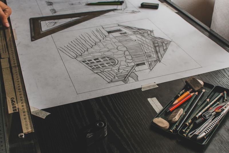 Technical drawing and drafting tools on a drafting table