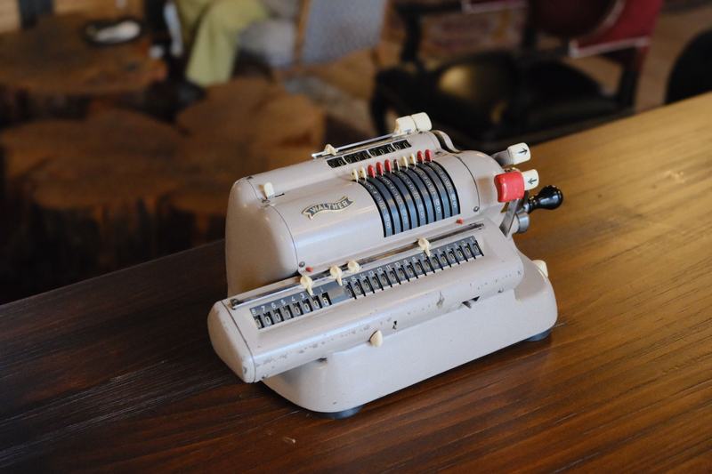 Mechanical calculating machine on a wooden desk