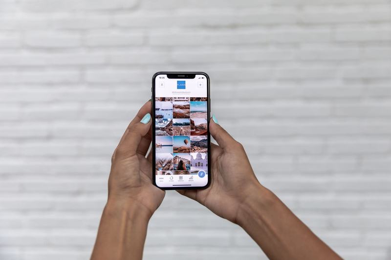 Person browsing a photo gallery on a smartphone