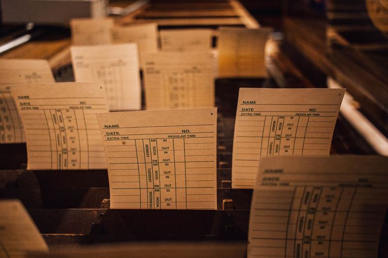 Stack of punched cards under warm light