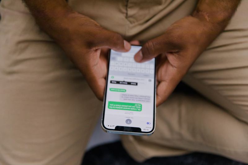 Person typing a message on a smartphone